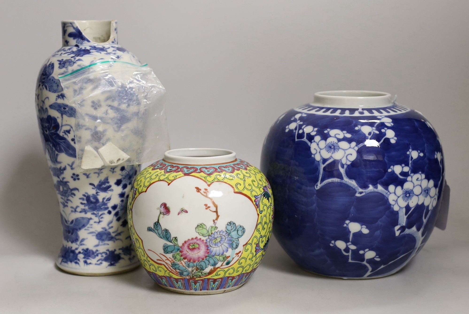 A 19th century Chinese blue and white ‘birds and flowers’ baluster vase, a blue and white jar and a famille rose jar